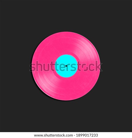 Vinyl long play record in retro bright neon colors on a black background. Vintage phonograph record concept