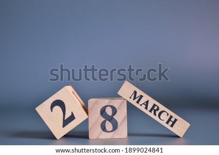 March 28, Cover in the evening time, Date Design with number cube for a background.
