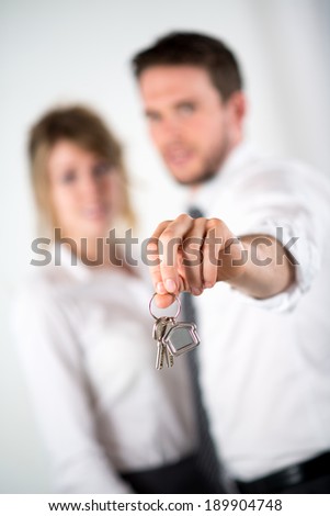 close-up picture of cheerful couple holding house keys