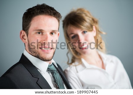 handsome young executive business man with female coworker