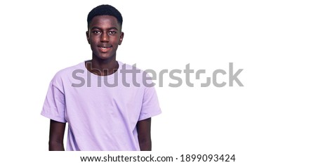 Young african american man wearing casual clothes with a happy and cool smile on face. lucky person. 