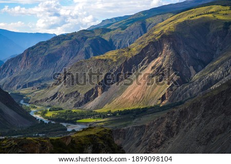 Breathtaking view to Chulishman river valley captured from Katu-Yarik pass. Altai nature. Travel in Russia concept. Mountain valley landscape. Natural landscape.