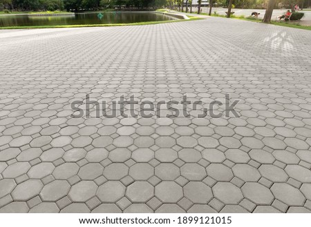Truncated square tiling pattern of paver brick floor or block paving. Construction or lay on ground at outdoor for road, street, pavement, sidewalk, floor, path, footpath, walkway, patio or background Royalty-Free Stock Photo #1899121015