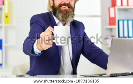 charge of energy. working as actuary. skills business majors have. skilled accountant wear office jacket. management consultant or analysts at laptop. financial analysts with morning coffee cup. Royalty-Free Stock Photo #1899136135