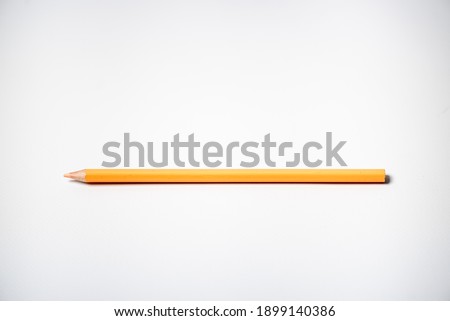 Single pencil on a white background