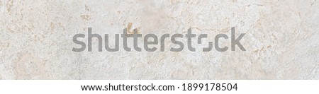 Beige limestone similar to marble surface or texture background in banner format. High resolution photography