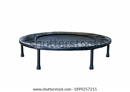 Black Trampoline on white background, for children and adults for fun indoor or outdoor jumping, Trampoline for fitness exercises Royalty-Free Stock Photo #1899257215