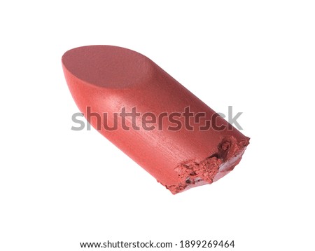 Cut pink lipstick isolated on white background