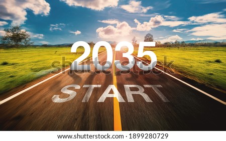 2035 Start written on highway road in the middle of empty asphalt road  and beautiful blue sky. Concept for vision 2035.