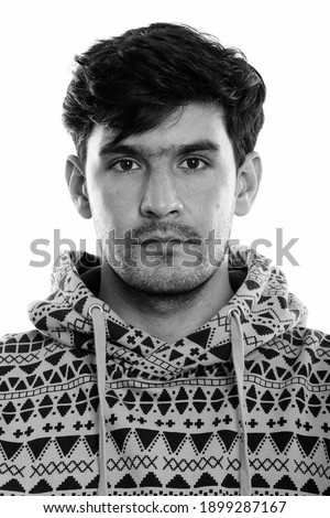 Face of young Persian man wearing hoodie