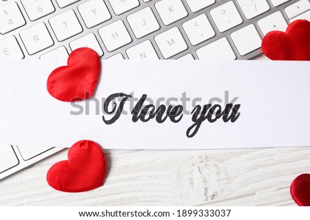 Card with text I Love You, red hearts and keyboard on white wooden background, flat lay