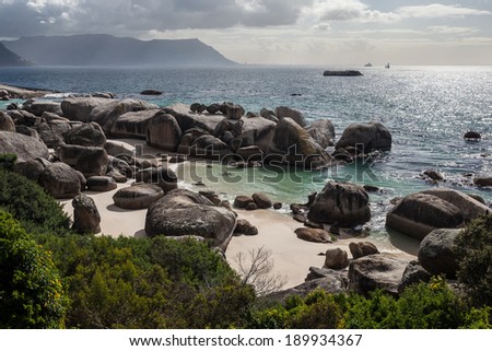 The beautiful coastline of False Bay, South Africa, is strewn with massive boulders, tide pools, and white sand beaches.