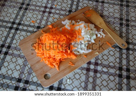 Carrots and onion on the cutting board