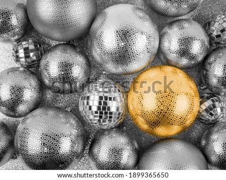 Close up top view of pile scattered silver shimmering Christmas balls,various sizes,one golden.Festive shiny,disco mirror decoration.Holiday,celebration concept,card design,discounts,banner,copy space