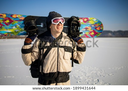 Picture Of Sports Man Wearing Helmet With Snowboard