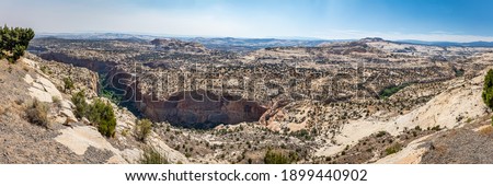 View of Calf Creek Canyon and Lower Calf Creek Falls Trail from the Calf Creek Viewpoint along the Hogback section of Utah Highway 12 in Grand Staircase - Escalante National Monument. Royalty-Free Stock Photo #1899440902