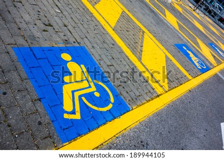 detail of the symbols painted on a disabled reserved parking lot