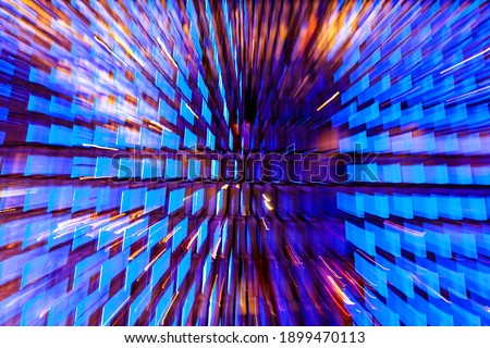 Neon light windows moving in to deep space center zoom effect, bright blue and pink.  futuristic explosion of colors in the shape of blue windows. Modern futuristic. pattern-like scape. Background Royalty-Free Stock Photo #1899470113