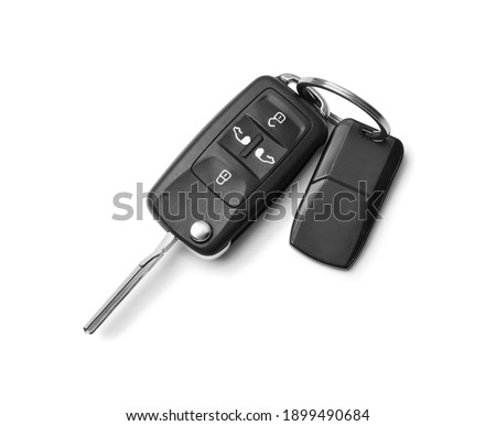 Modern car flip key with trinket isolated on white, top view Royalty-Free Stock Photo #1899490684