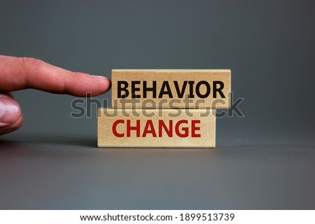 Time to behavior change symbol. Wooden blocks with words 'behavior change'. Beautiful grey background. Businessman hand. Copy space. Business, psychology and behavior change concept. Royalty-Free Stock Photo #1899513739