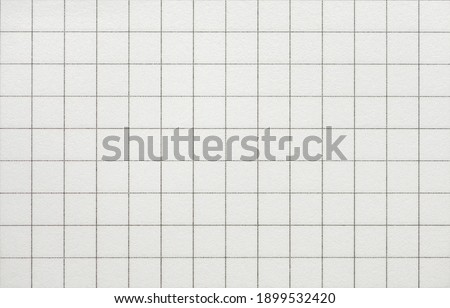 Checkered blank note paper texture, macro shot. Empty page. Royalty-Free Stock Photo #1899532420