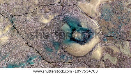 abyssal eye,  United States, abstract photography of relief drawings in  fields in the U.S.A. from the air, Genre: Abstract Naturalism, from the abstract to the figurative,  