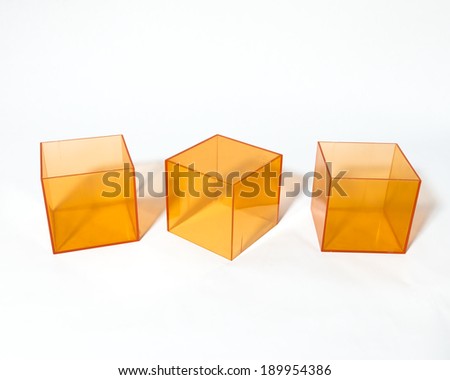 Translucent orange cube boxes from several different angles against a white background for designers or digital artists.
