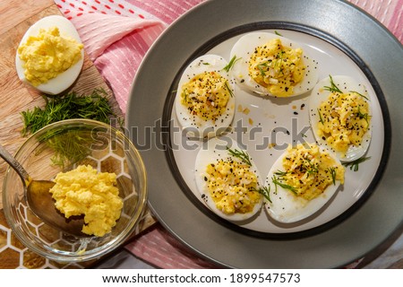 Stuffed Russian deviled eggs topped with everything bagel seasoning