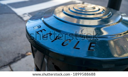 Metal recycle trash bin on the street. close up