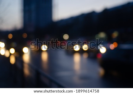 Blurred view of city street with traffic lights bokeh background