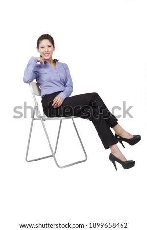 A Business woman sitting on a chair high quality photo