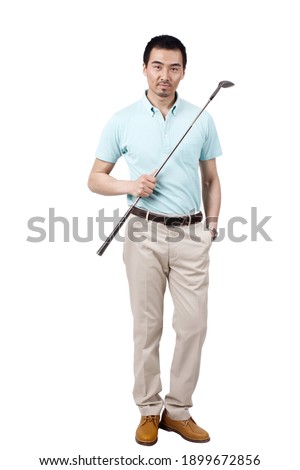 Young man wearing a suit and golfing high quality photo