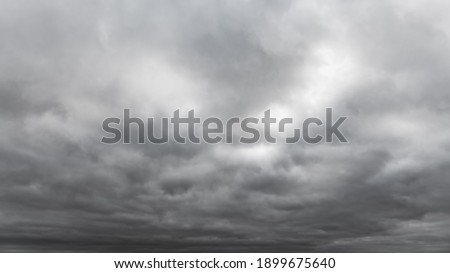Dark storm clouds on sky background Royalty-Free Stock Photo #1899675640
