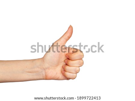 Hand gesture - thumbs up, isolated on a white background. The female palm points to something that is empty for your design. Royalty-Free Stock Photo #1899722413