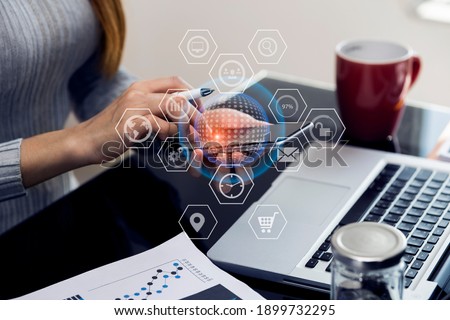 Double exposure of businesswoman working on digital smart phone with digital marketing virtual chart, Abstract icon, Technology and business strategy concept. blurred background.