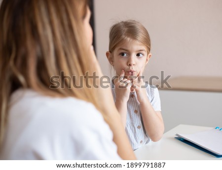 speech therapist practice therapy for child with motor speech disorders. Royalty-Free Stock Photo #1899791887
