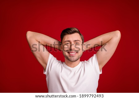 Photo portrait of male worker relaxing laying on pause smiling isolated vivid red color background