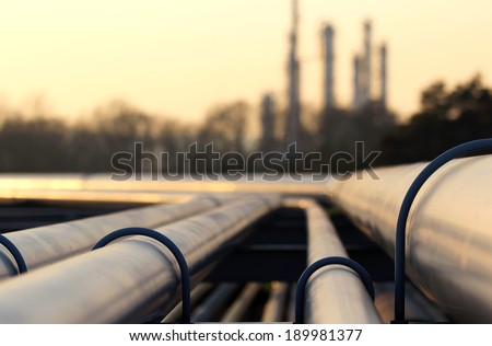 steel pipes in crude oil factory Royalty-Free Stock Photo #189981377