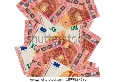 10 euro bills flying down isolated on white. Many banknotes falling with white copy space on left and right side