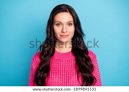 Photo of serious charming brunette young woman wear pink pullover isolated on pastel blue color background