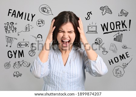 Stressed young woman, text and drawings on grey background Royalty-Free Stock Photo #1899874207