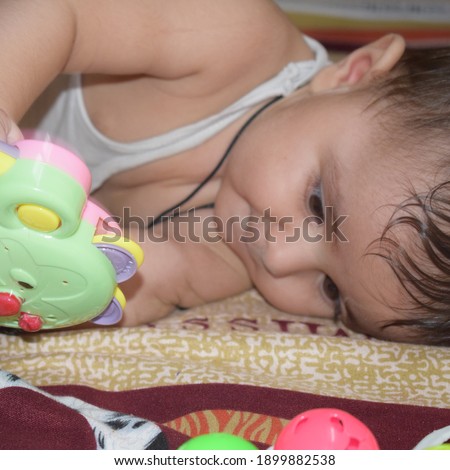 11 Month Baby Boy Indoors in Summer - stock photo, Cute Boy playing on the bed, Sweet Little baby boy enjoying inside house
