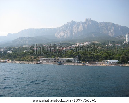 The photo is made in 2008 in Crimea. The view on the seashore and Ai-Petri.