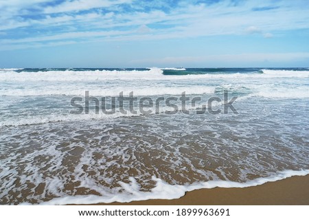white transparent sea foam on the sand by the mediterranean sea
