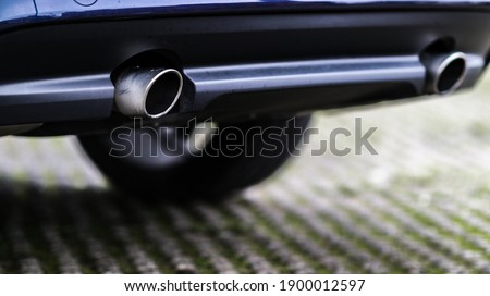 A selective focus shot of a pipe of a modern car