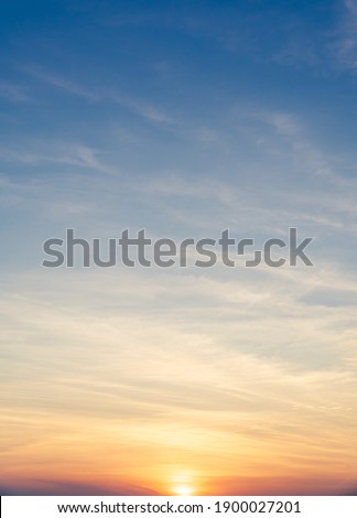 Sunset Sky vertical in the morning with  blue and orange Sunrise on clouds fluffy, Horizon Sky Background  Royalty-Free Stock Photo #1900027201
