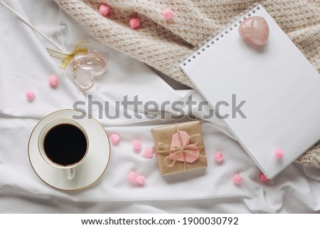 Flat lay Happy Valentine's Day photography with gift box and paper origami hearts. Romantic greeting card. 
