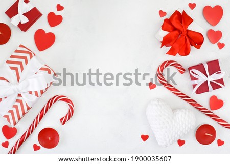 Wooden white background with gifts and hearts. Layout for St. Valentine's Day. It is also available for text.