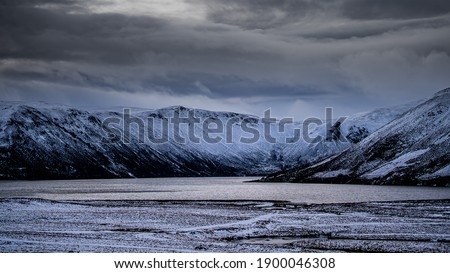 A scenic views for the stunning Loch Muick in winter time in the Scottish Highlands, the use of wide as well as high resolution leneses reflects brilliant colours such as grey, orange, purple, and blu