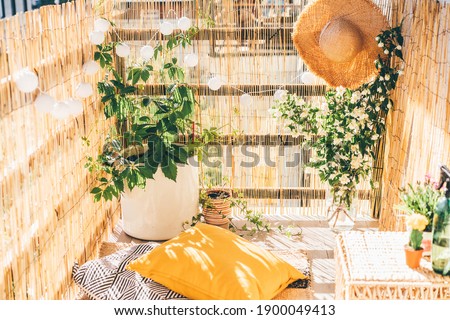 Eco friendly bamboo terrace. Orange pillows on the floor.  Royalty-Free Stock Photo #1900049413